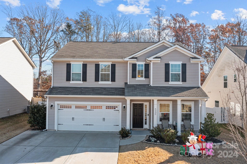 front of property with a garage