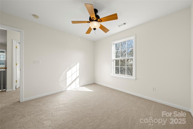 carpeted empty room with ceiling fan