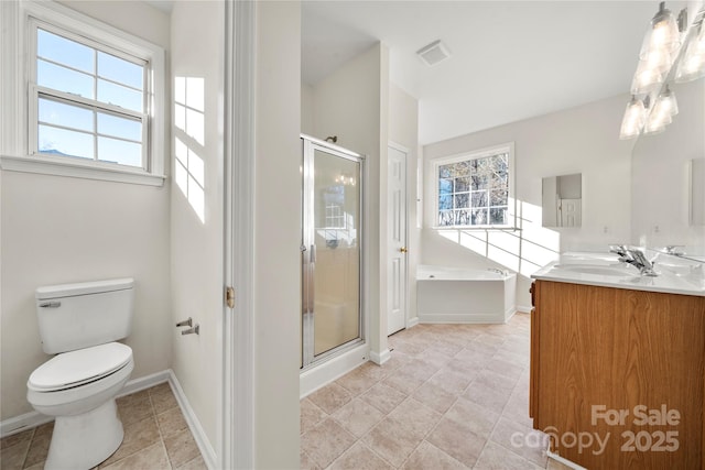 full bathroom featuring separate shower and tub, vanity, and toilet