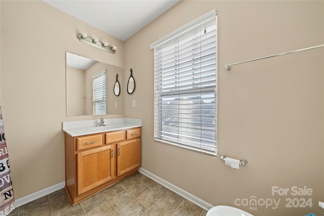 bathroom featuring tile patterned floors and vanity