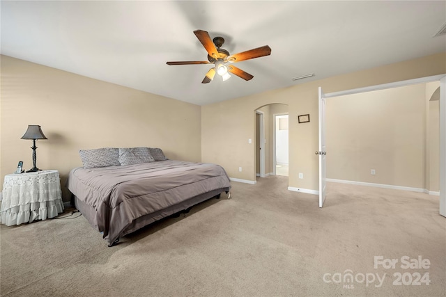 carpeted bedroom with ceiling fan