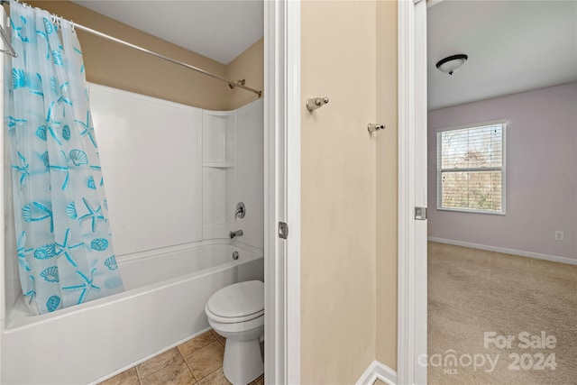 bathroom with shower / bath combination with curtain, toilet, and tile patterned floors