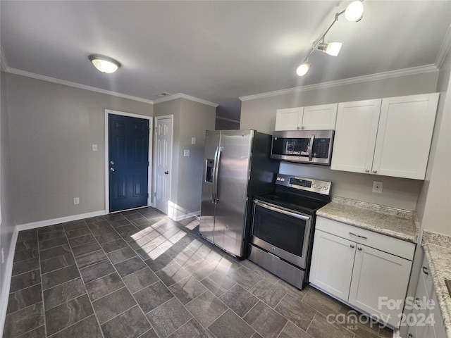 kitchen featuring rail lighting, stainless steel appliances, light stone counters, crown molding, and white cabinets