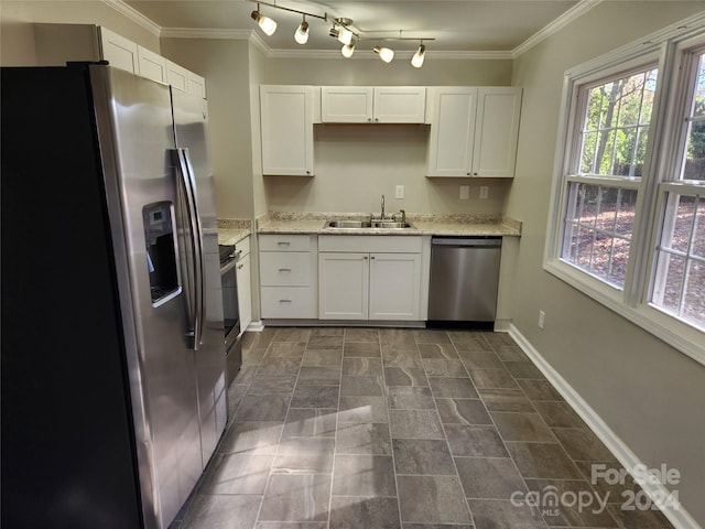 kitchen with crown molding, sink, white cabinetry, and stainless steel appliances