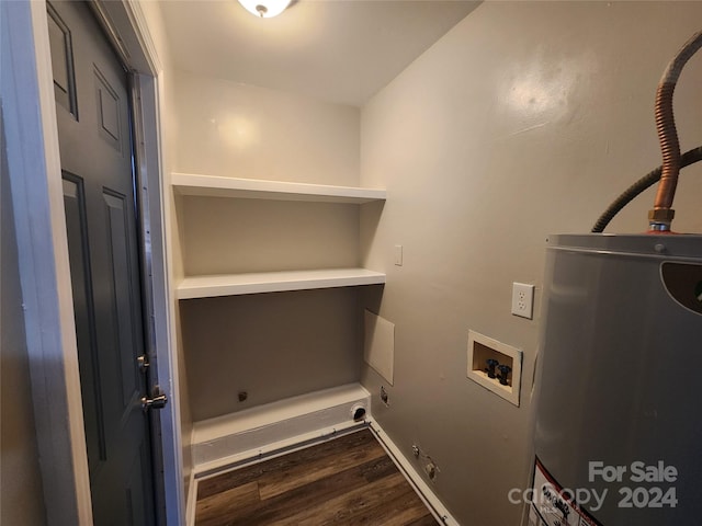 laundry room with washer hookup, dark hardwood / wood-style floors, and gas water heater