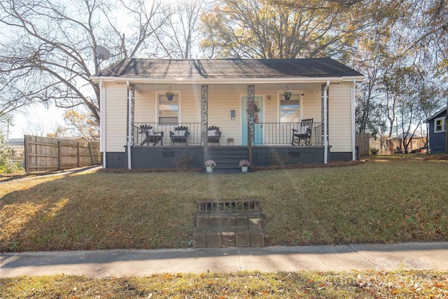 bungalow-style house with a front lawn and covered porch