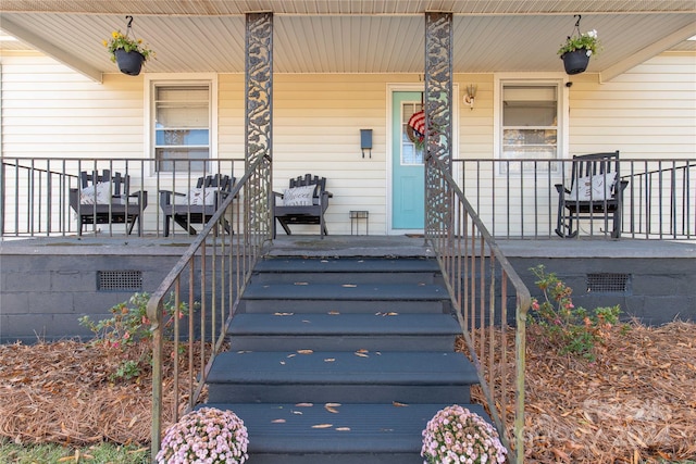 property entrance featuring covered porch