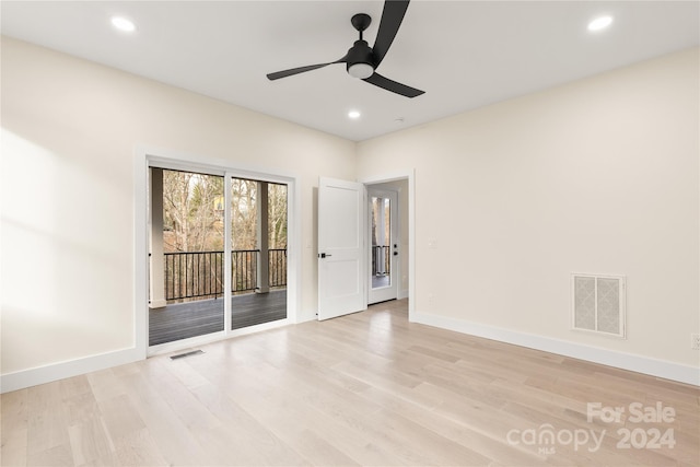 empty room with ceiling fan and light wood-type flooring