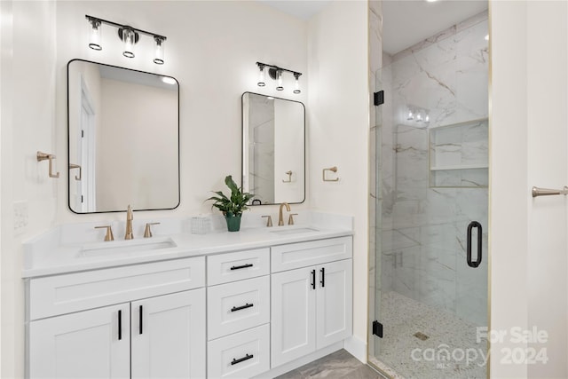 bathroom featuring vanity and a shower with shower door