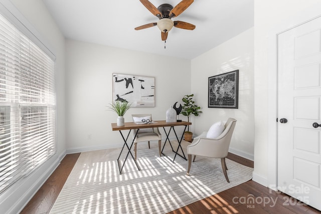 office with ceiling fan and dark hardwood / wood-style floors