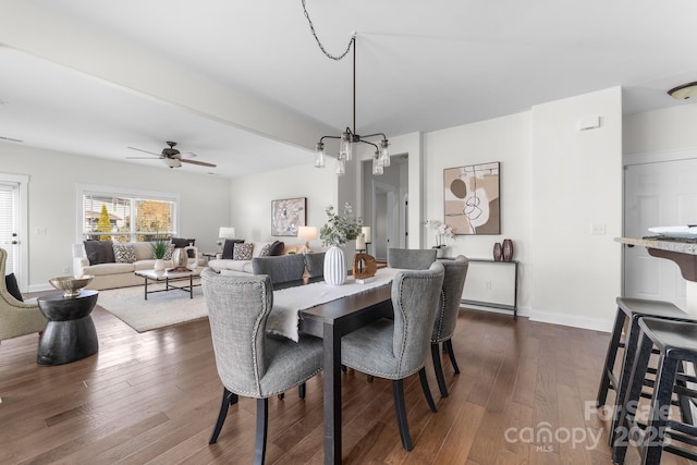 dining area featuring ceiling fan and dark wood-type flooring