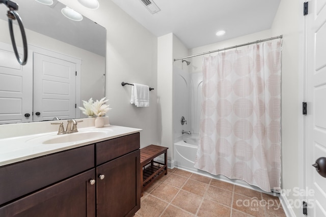 bathroom featuring vanity and shower / bath combo