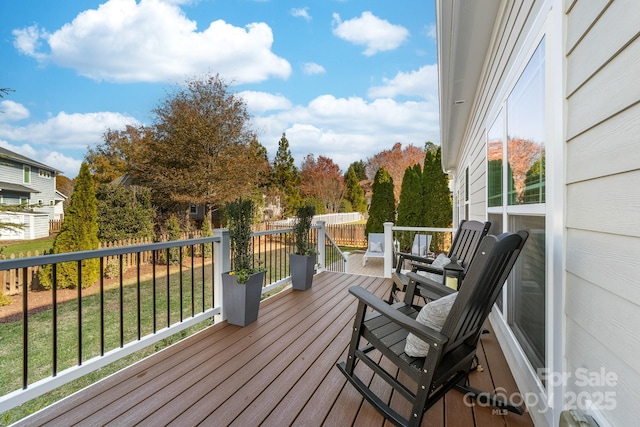 wooden deck with a yard