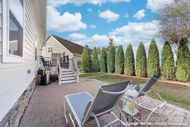 view of patio / terrace featuring a grill and a wooden deck