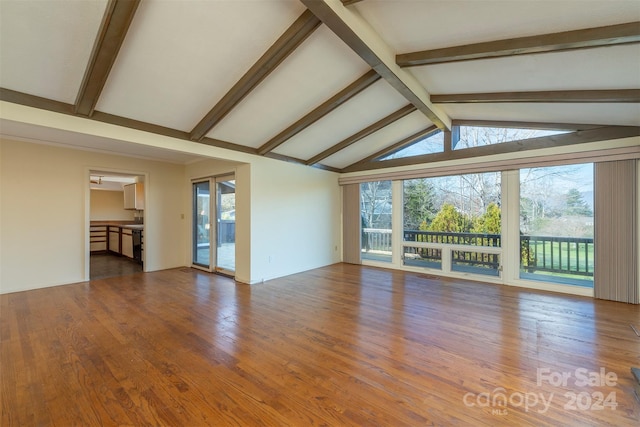 208 Dogwood Ln, Black Mountain, NC 28711 - unfurnished living room with vaulted ceiling with beams and wood-type flooring