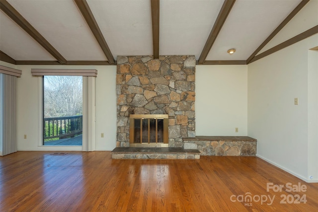 208 Dogwood Ln, Black Mountain, NC 28711 - unfurnished living room featuring a fireplace, hardwood / wood-style floors, and lofted ceiling with beams
