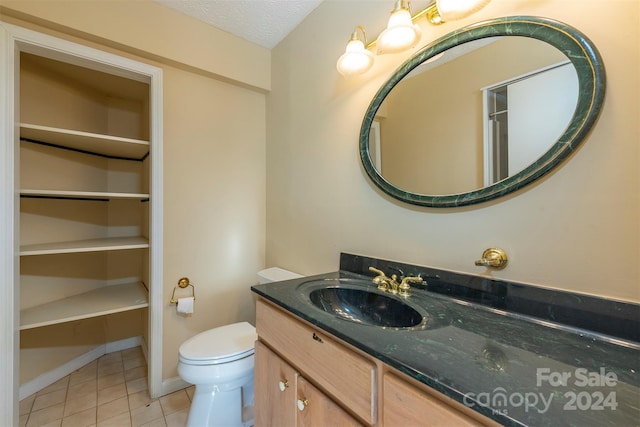 208 Dogwood Ln, Black Mountain, NC 28711 - bathroom featuring tile patterned floors, vanity, a textured ceiling, and toilet