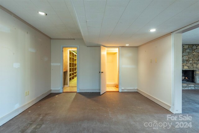 208 Dogwood Ln, Black Mountain, NC 28711 - unfurnished room featuring a stone fireplace