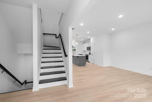 stairway featuring hardwood / wood-style flooring