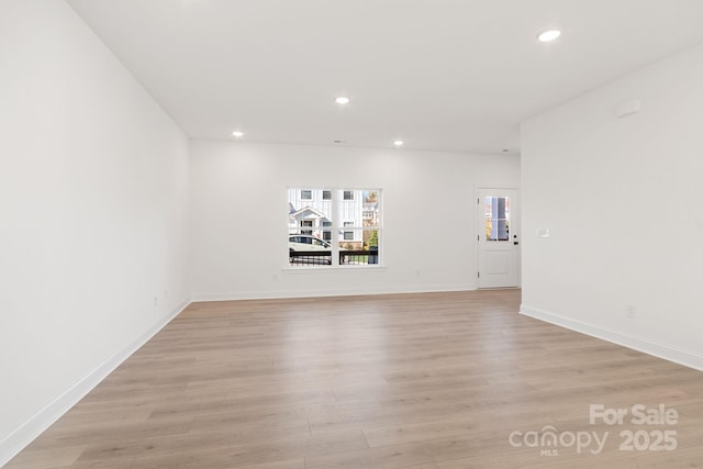 spare room with light wood-type flooring