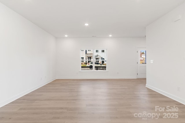 spare room featuring light wood-type flooring