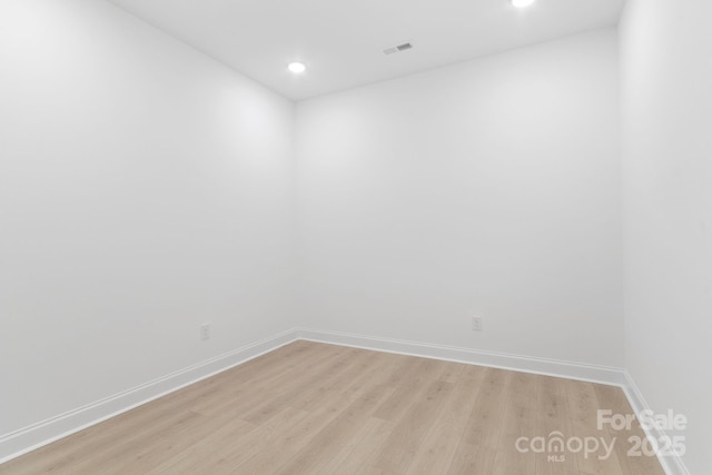 spare room featuring light hardwood / wood-style floors