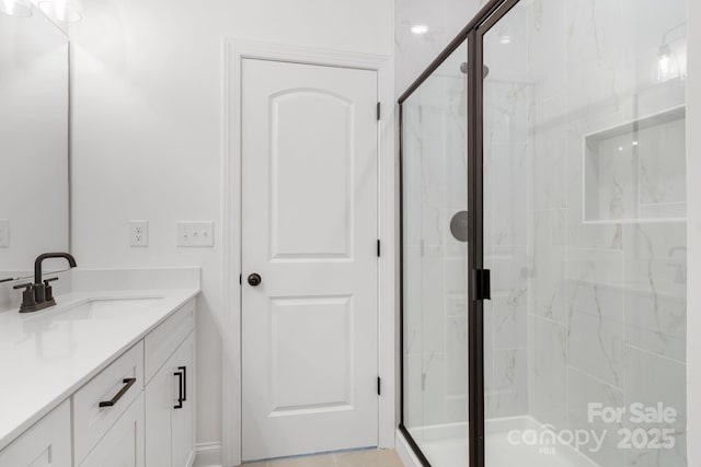 bathroom with vanity and an enclosed shower