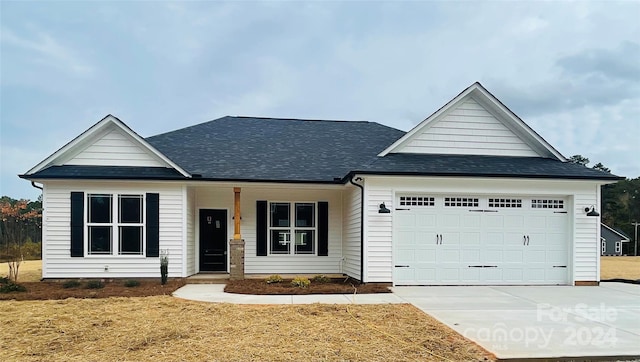 view of front facade featuring a porch and a garage