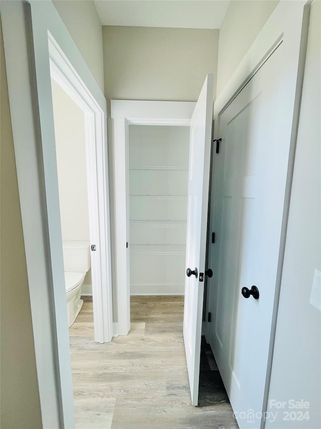 hallway featuring light hardwood / wood-style flooring