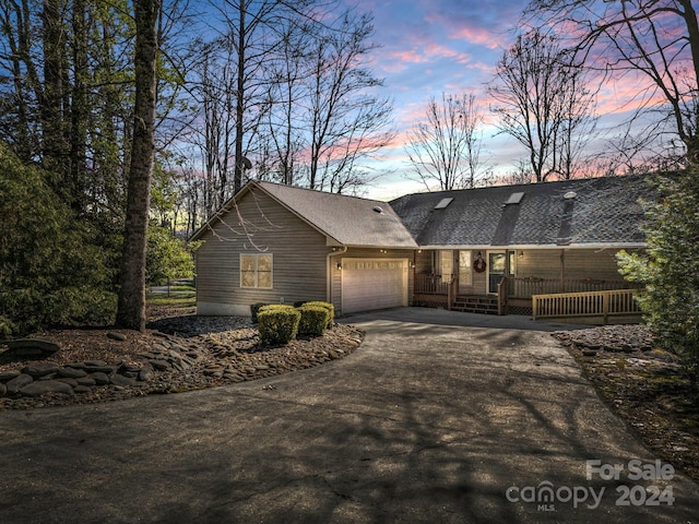 single story home featuring a garage