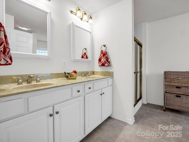 bathroom featuring walk in shower, tile patterned floors, and vanity