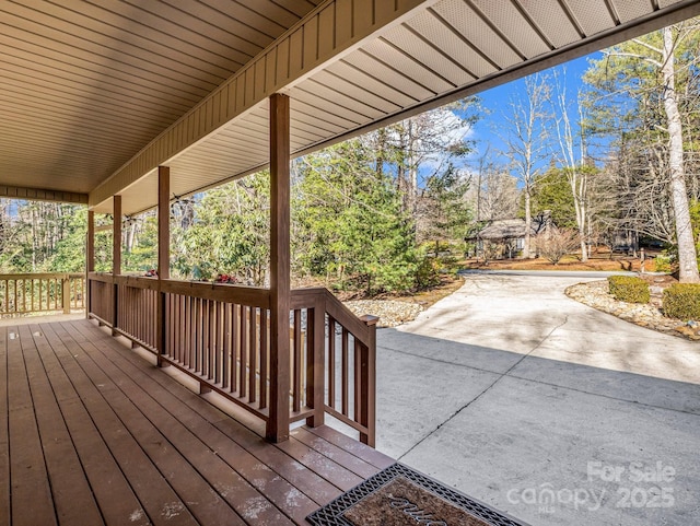 wooden terrace with a patio