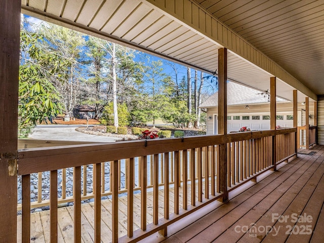 wooden deck with a garage