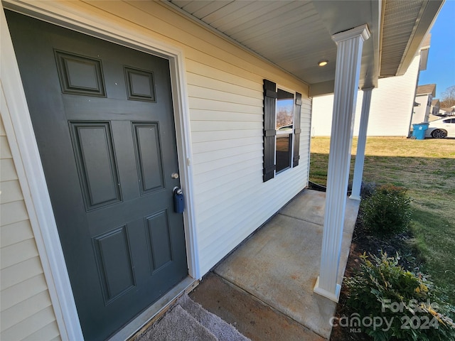 doorway to property with covered porch