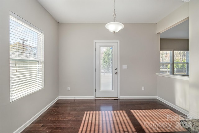 doorway to outside with dark hardwood / wood-style flooring