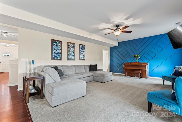 living room with hardwood / wood-style flooring and ceiling fan