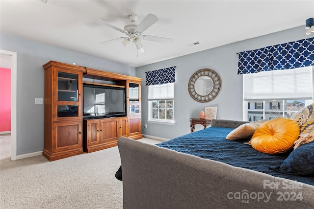 carpeted bedroom with ceiling fan