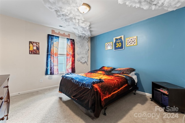 bedroom featuring light carpet