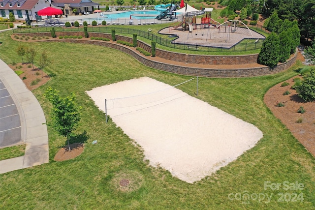 view of community featuring a lawn and a playground