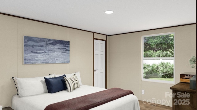 bedroom with wood-type flooring and a textured ceiling