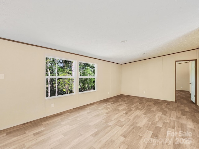20 Windy Mountain Ln Unit 1, Hendersonville, NC 28792 - empty room with light wood finished floors and crown molding