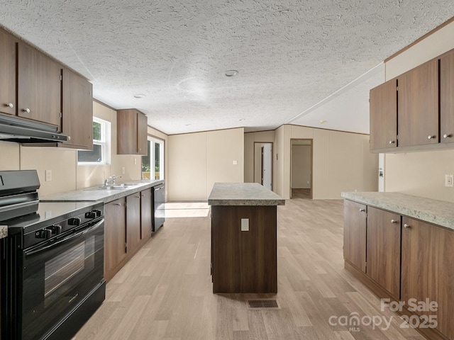 20 Windy Mountain Ln Unit 1, Hendersonville, NC 28792 - kitchen with black range with electric stovetop, light wood-type flooring, a center island, under cabinet range hood, and a textured ceiling