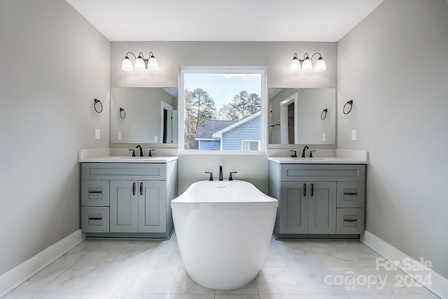 bathroom with vanity and a tub to relax in