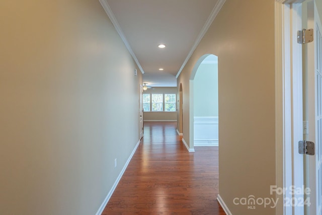 hallway featuring dark hardwood / wood-style floors and ornamental molding