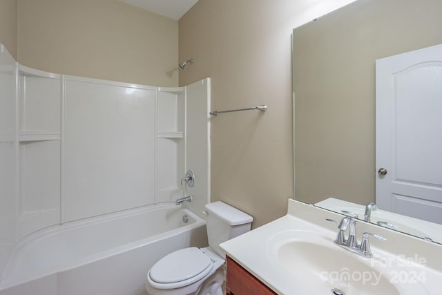 full bathroom with vanity, toilet, and shower / washtub combination