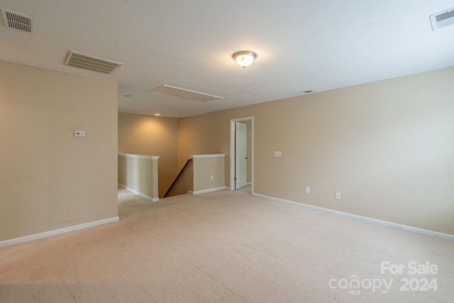 empty room featuring light carpet