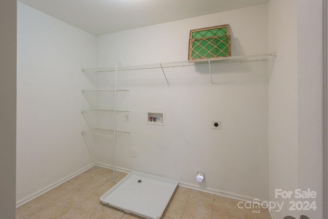 washroom with light tile patterned floors, washer hookup, and hookup for an electric dryer