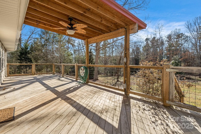 wooden terrace featuring ceiling fan