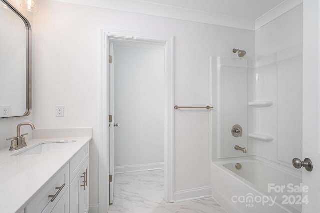 bathroom featuring shower / bathing tub combination, vanity, and crown molding