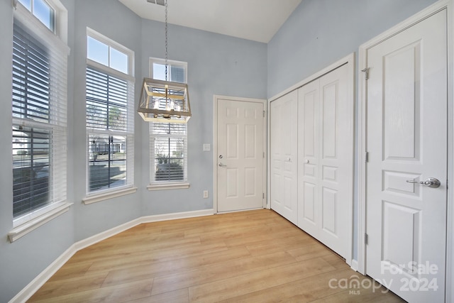 foyer entrance with light hardwood / wood-style flooring